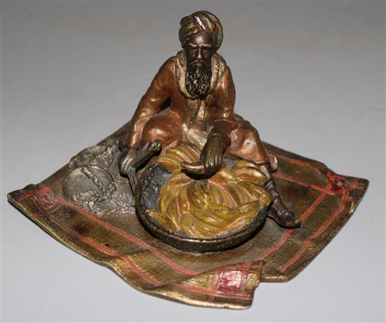 A cold painted bronze banana seller